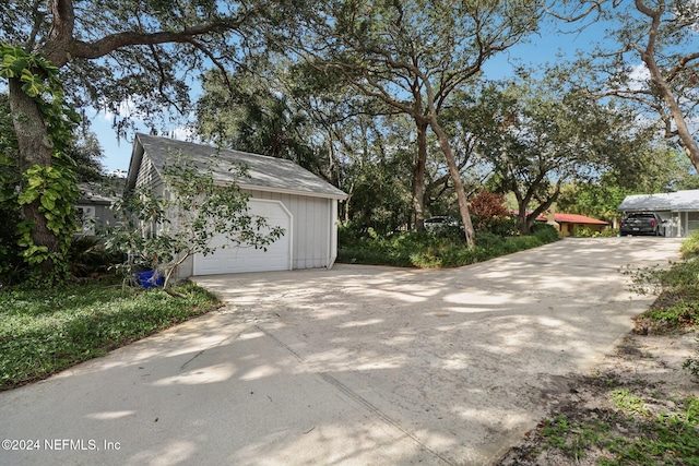 exterior space featuring an outdoor structure and a garage