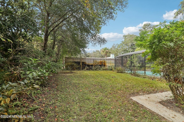 view of yard featuring a lanai