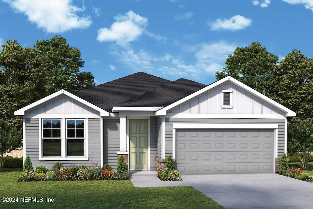 view of front facade with a garage and a front yard