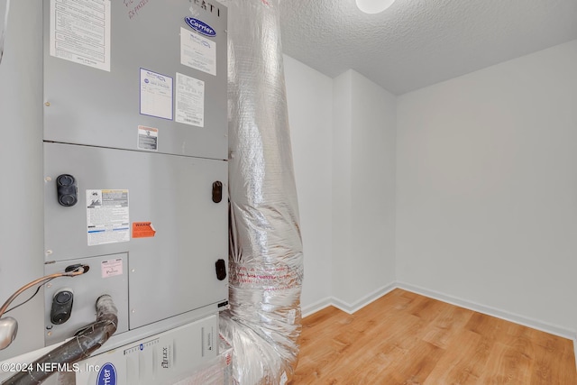 utility room with heating unit