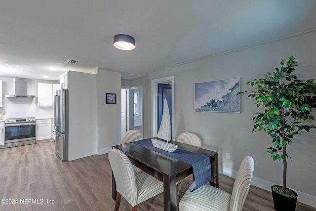 dining space featuring light hardwood / wood-style flooring