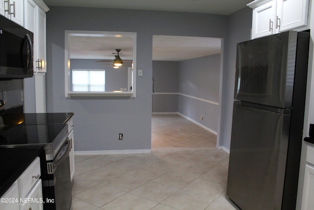 kitchen with white cabinets, ceiling fan, light tile patterned floors, and appliances with stainless steel finishes