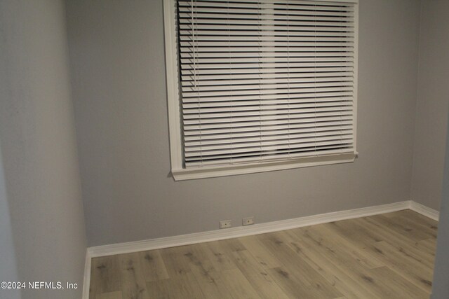 spare room featuring light hardwood / wood-style flooring