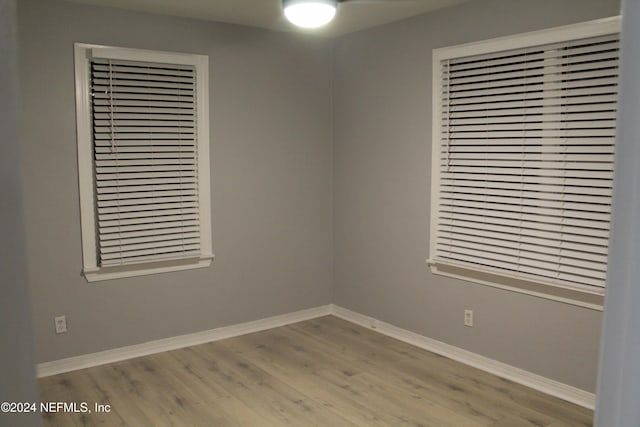 unfurnished room with light hardwood / wood-style floors