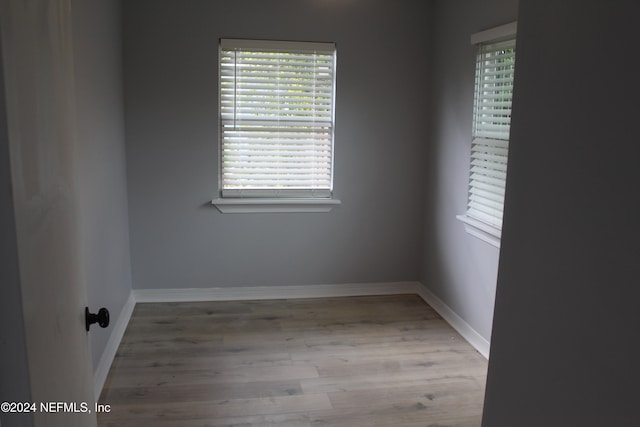 spare room featuring light hardwood / wood-style floors