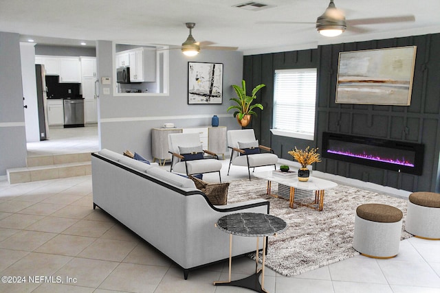 tiled living room with ceiling fan