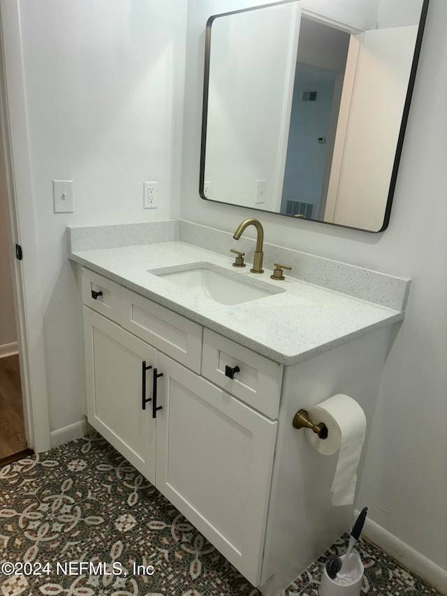 bathroom with vanity and tile patterned floors