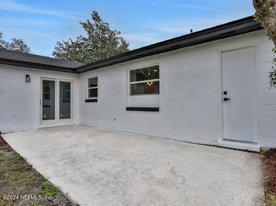 rear view of house featuring a patio