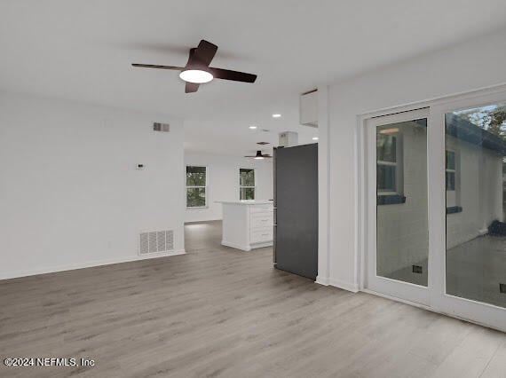 interior space featuring light wood-type flooring and ceiling fan