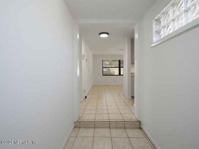 hallway featuring light tile patterned floors