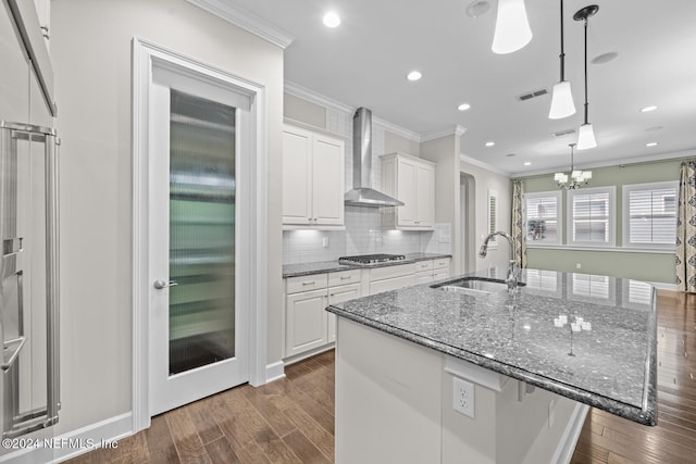 kitchen featuring white cabinets, sink, wall chimney exhaust hood, and dark hardwood / wood-style floors