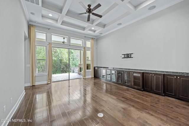 spare room with ornamental molding, coffered ceiling, ceiling fan, beamed ceiling, and hardwood / wood-style floors