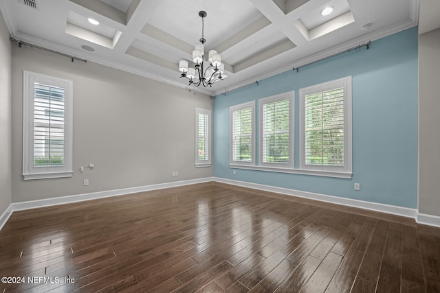 spare room with a healthy amount of sunlight and coffered ceiling