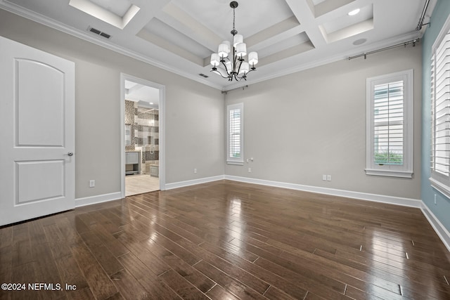 spare room featuring a notable chandelier, dark hardwood / wood-style flooring, crown molding, and coffered ceiling