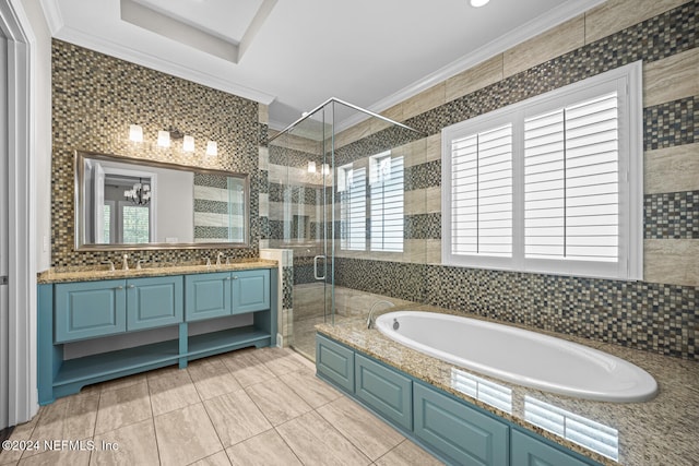 bathroom with independent shower and bath, crown molding, a wealth of natural light, and tile walls