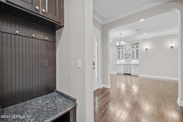 mudroom featuring crown molding and hardwood / wood-style floors