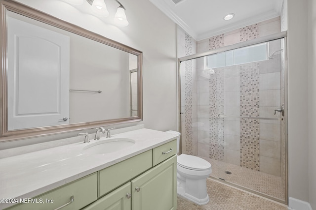 bathroom featuring tile patterned floors, ornamental molding, vanity, toilet, and a shower with shower door