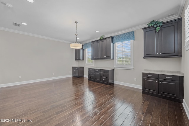 unfurnished dining area with crown molding and dark wood-type flooring