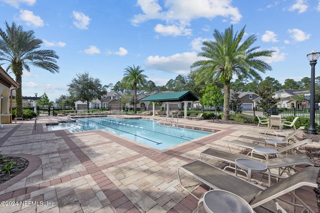 view of swimming pool with a patio area