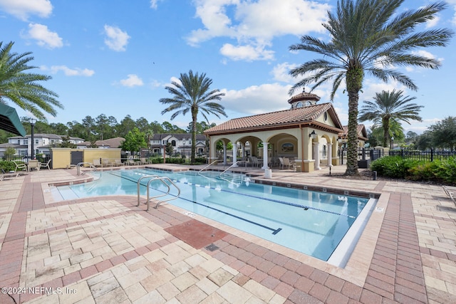 view of swimming pool featuring a patio area