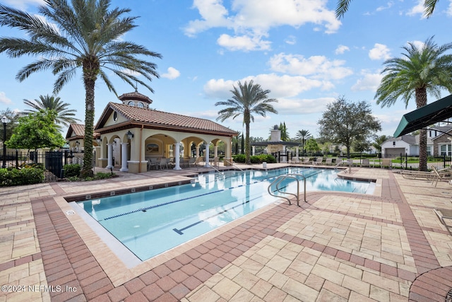 view of swimming pool with a patio