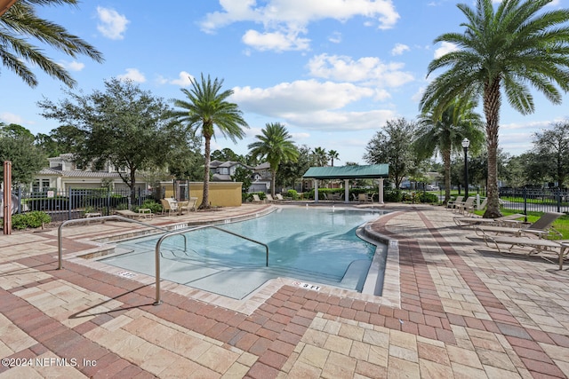 view of swimming pool featuring a patio area