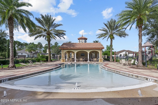 view of swimming pool with a patio area