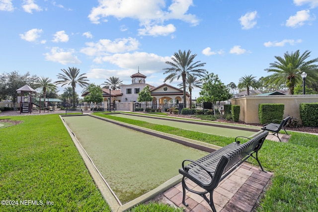 view of home's community featuring a lawn