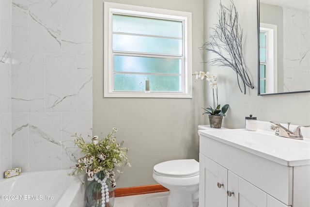 bathroom with toilet, a tub to relax in, and vanity