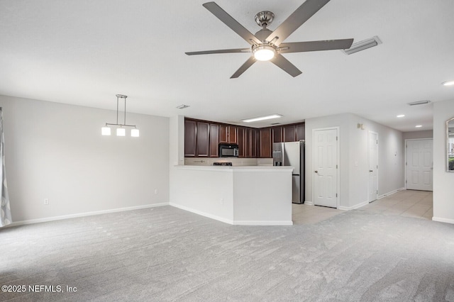 unfurnished living room featuring ceiling fan and light carpet