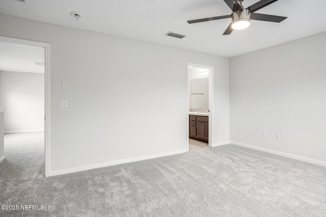 unfurnished room featuring light colored carpet and ceiling fan