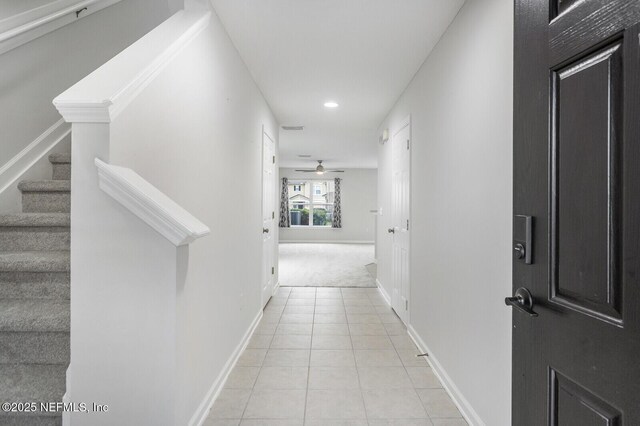 corridor with light colored carpet