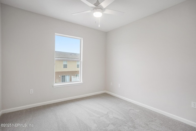 unfurnished room featuring carpet floors and ceiling fan