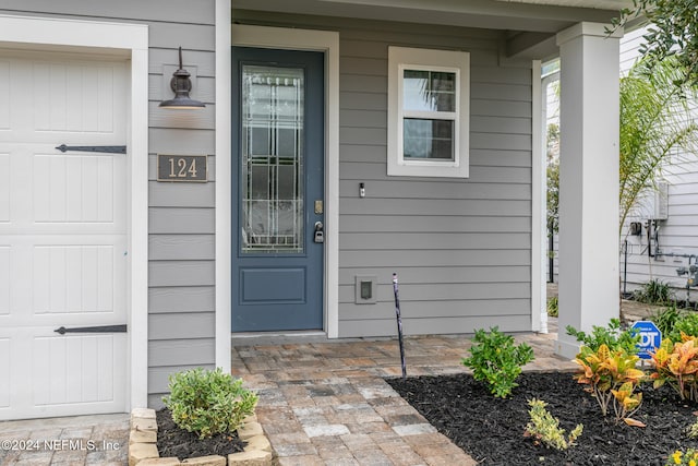 entrance to property featuring a garage