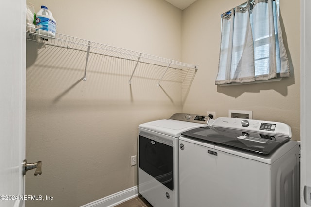 clothes washing area with washer and dryer