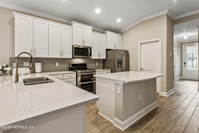 kitchen featuring light hardwood / wood-style floors, sink, light stone countertops, white cabinetry, and appliances with stainless steel finishes