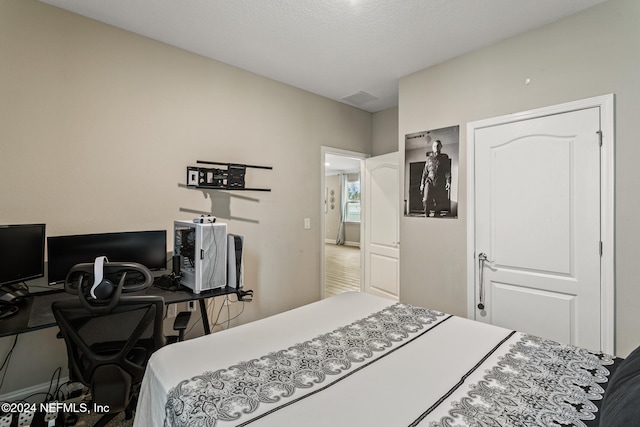 bedroom featuring a textured ceiling