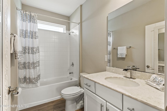 full bathroom featuring toilet, vanity, shower / bath combo with shower curtain, and wood-type flooring