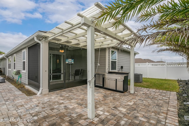 view of patio / terrace featuring central air condition unit and a pergola