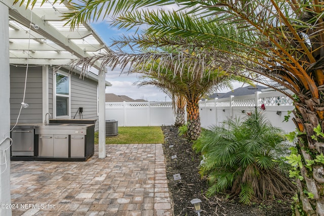 view of patio featuring cooling unit and a pergola