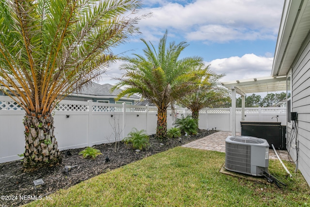 view of yard featuring central air condition unit