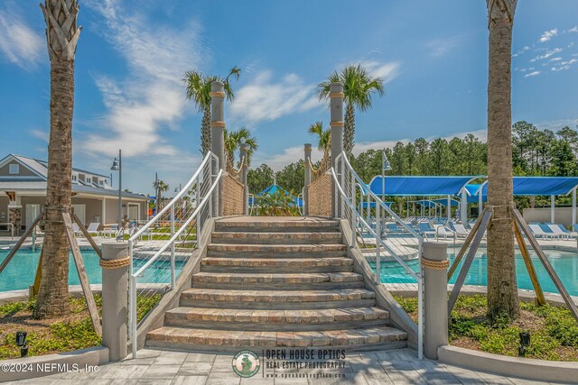 view of home's community featuring a pool