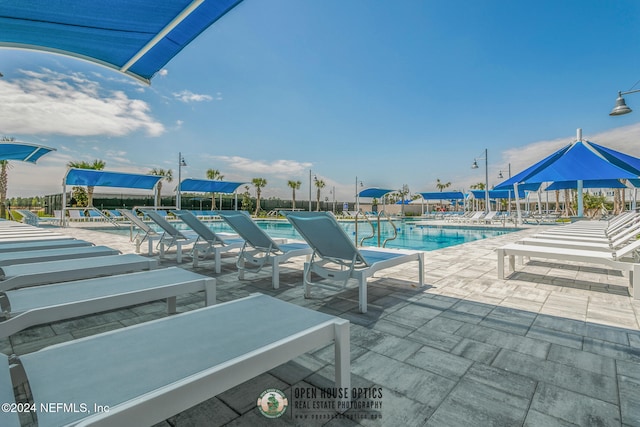 view of swimming pool featuring a patio