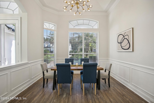 dining space with dark hardwood / wood-style flooring, a wealth of natural light, and ornamental molding