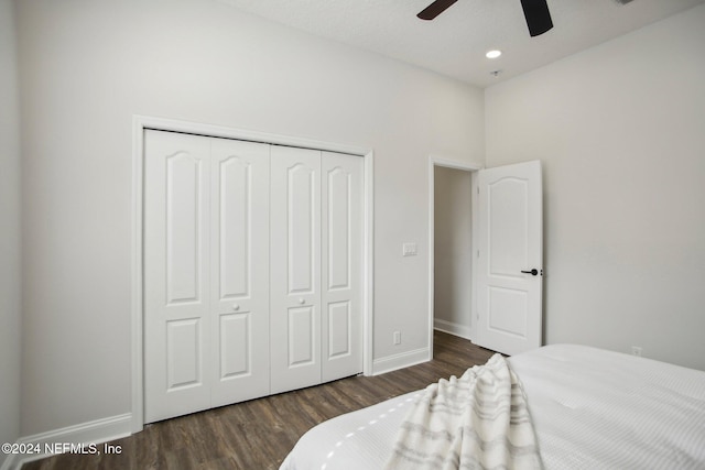 bedroom featuring dark hardwood / wood-style flooring, a closet, and ceiling fan