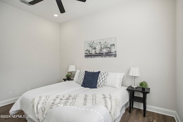 bedroom featuring ceiling fan and dark hardwood / wood-style flooring