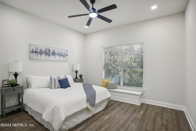 bedroom featuring dark hardwood / wood-style flooring and ceiling fan