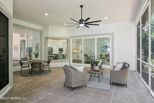 sunroom / solarium with ceiling fan