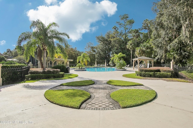 surrounding community featuring a gazebo and a pool