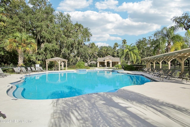 view of pool with a patio area and a gazebo